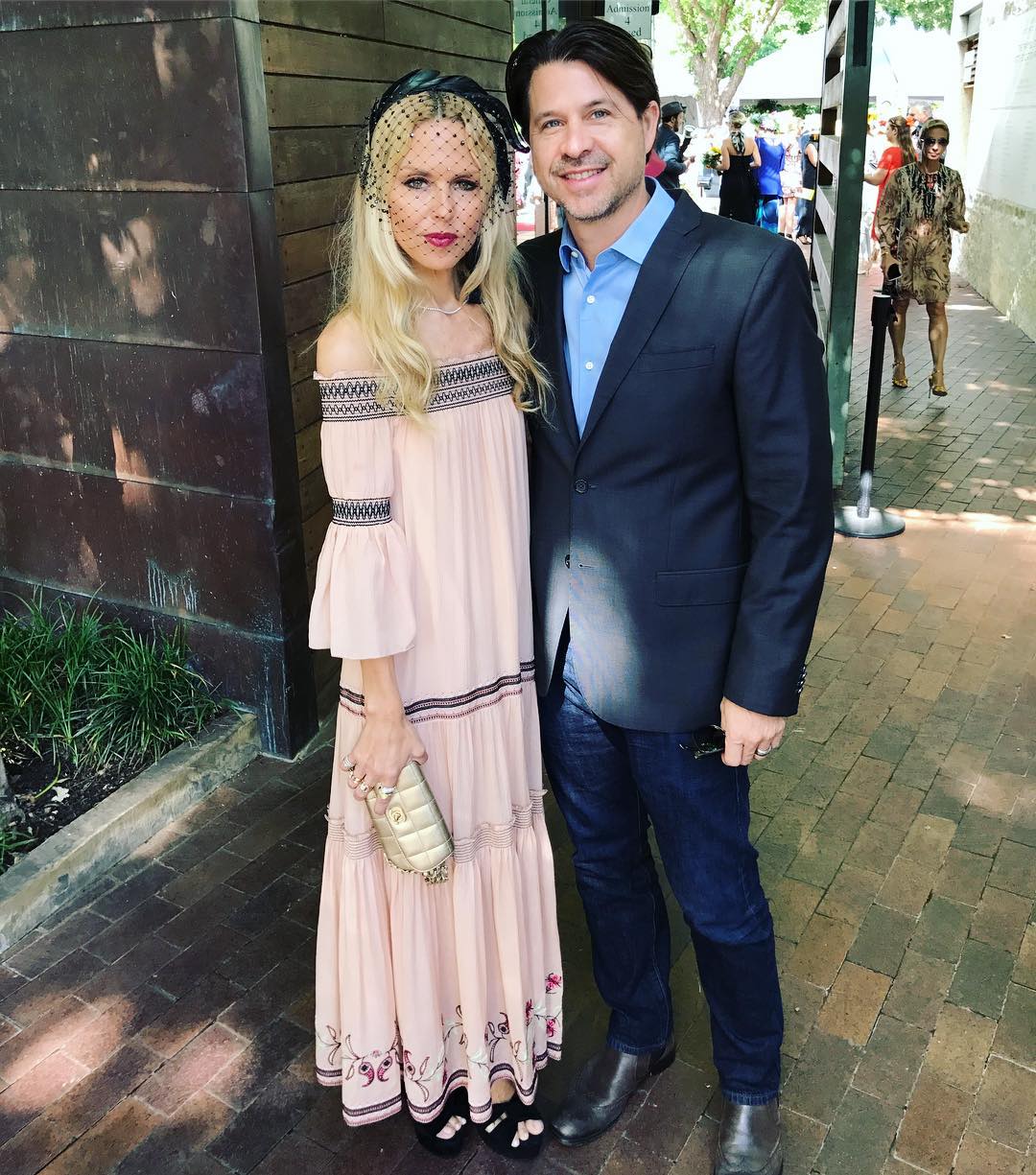 Rodger Berman at a fashion media event, dressed in a tailored suit, speaking with confidence in a professional setting