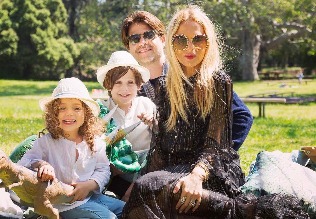 Rodger Berman at a fashion media event, dressed in a tailored suit, speaking with confidence in a professional setting