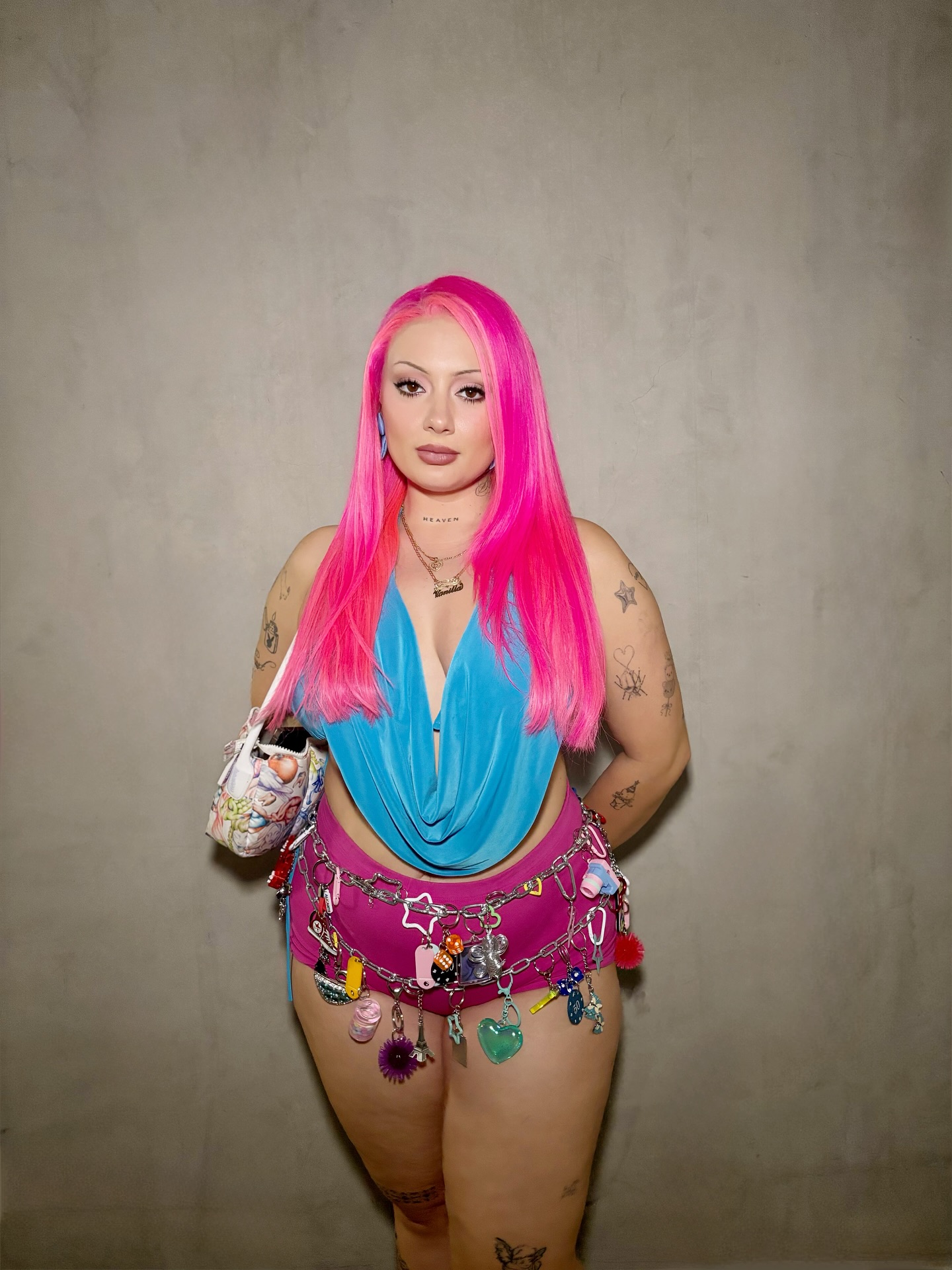 Streamer Vanillamace sitting at her setup with pink hair, speaking animatedly to chat during a live stream.