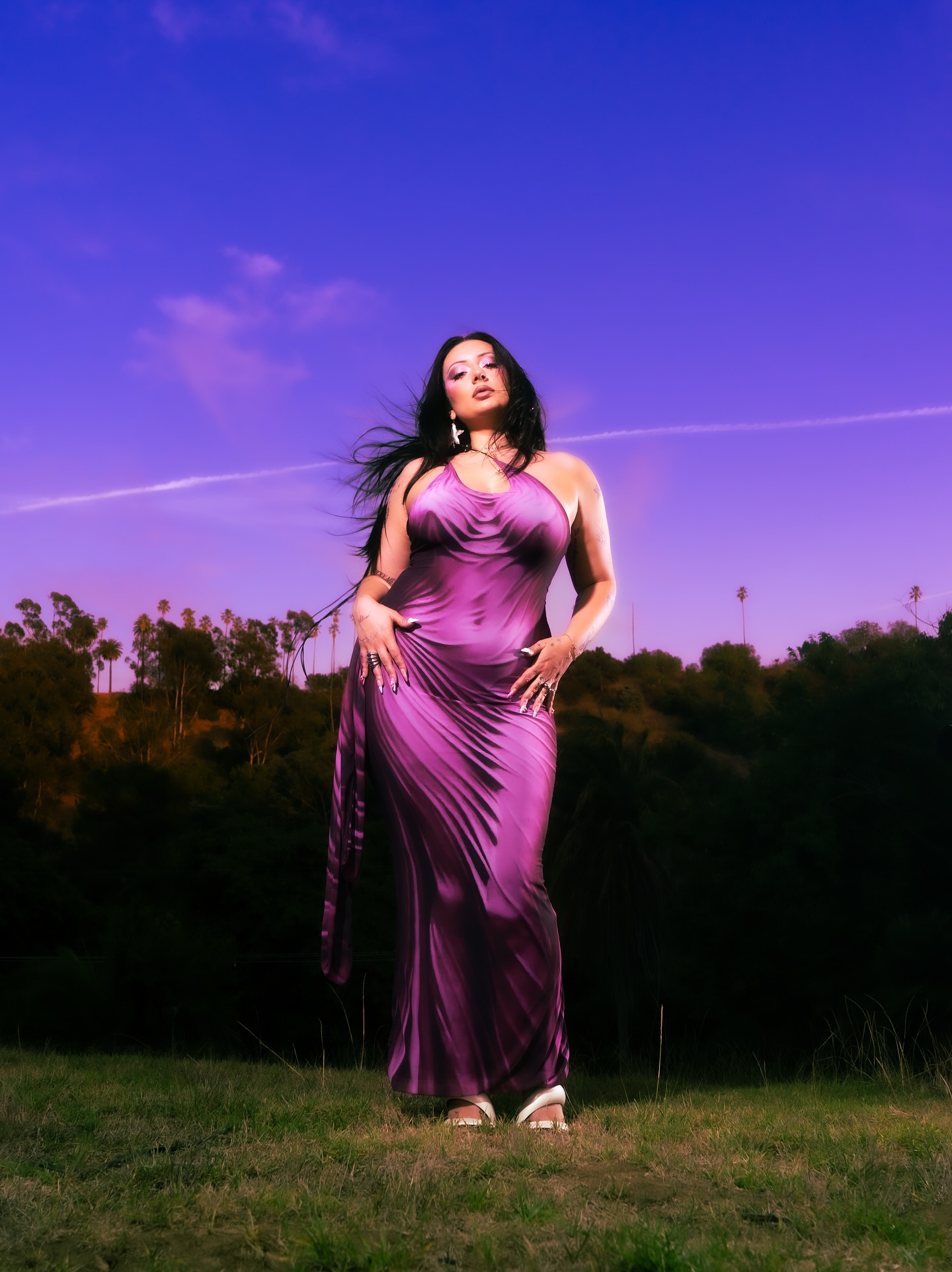 Streamer Vanillamace sitting at her setup with pink hair, speaking animatedly to chat during a live stream.