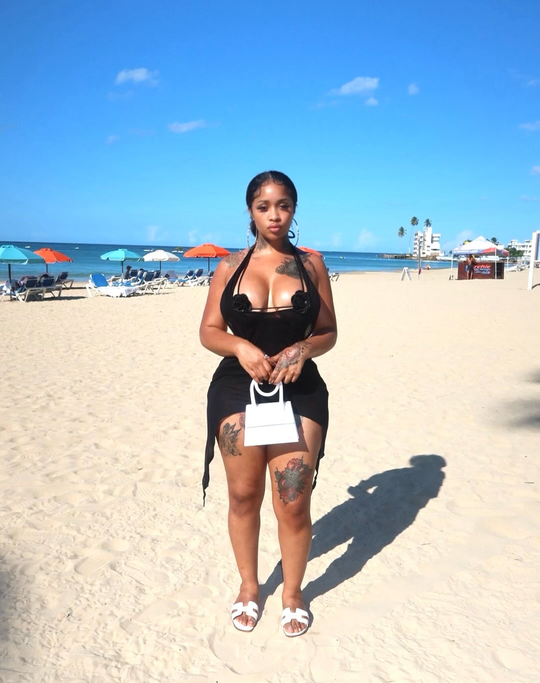 Stunna Girl performing with a confident stance and bold styling that reflects her Sacramento roots