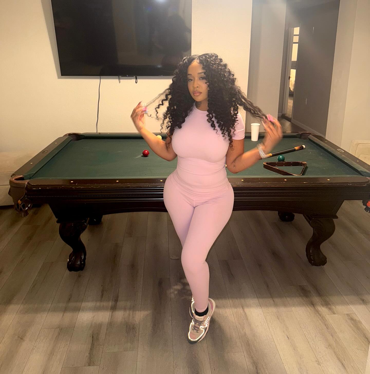 Stunna Girl performing with a confident stance and bold styling that reflects her Sacramento roots