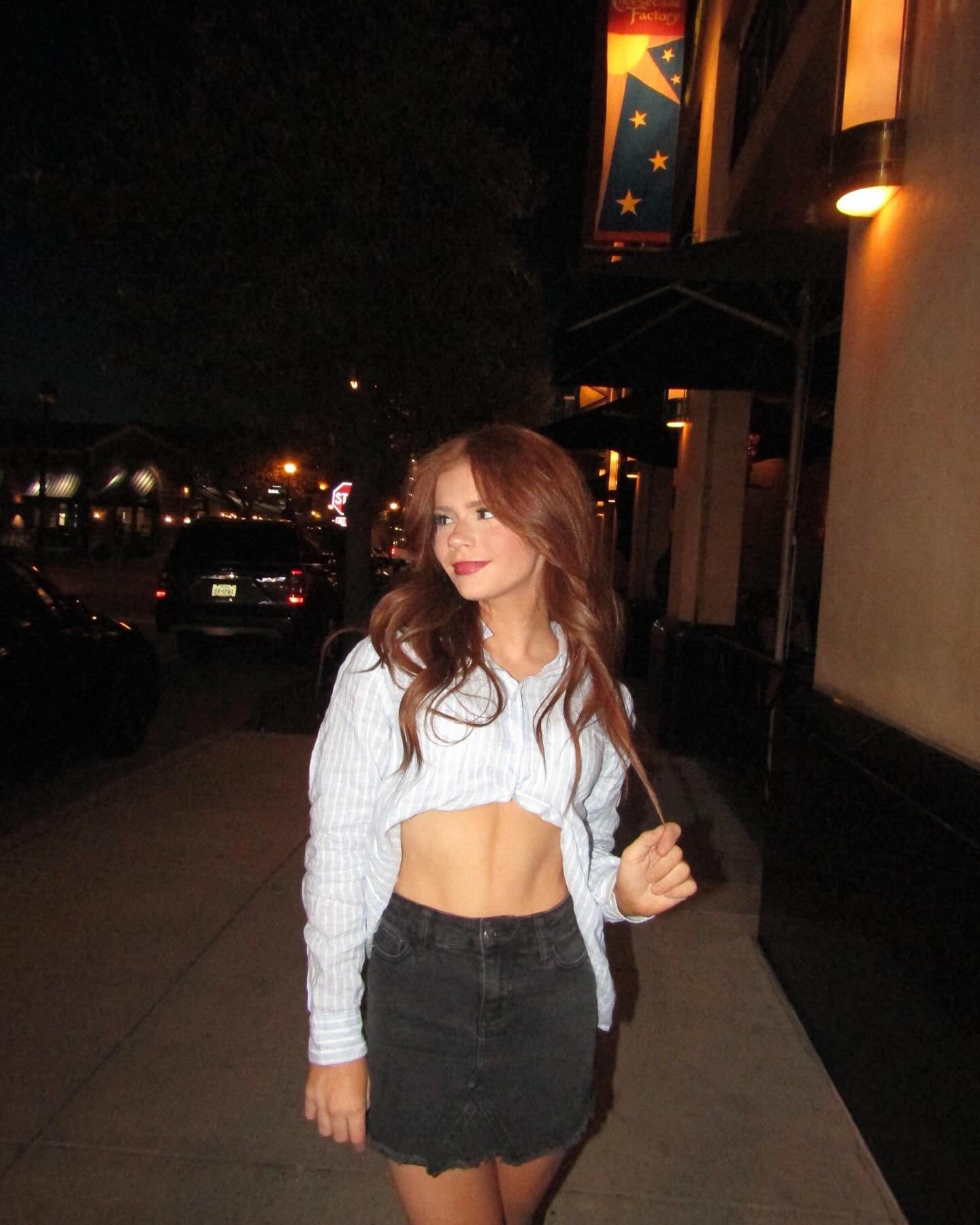 Teen creator Harper Zilmer filming a casual GRWM style video in a well lit bedroom, conveying confidence and authenticity.