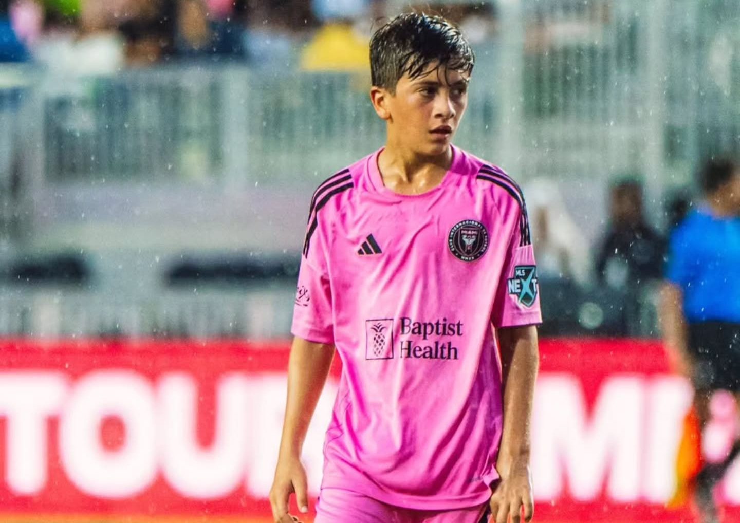 A thoughtful portrait of a 13-year-old boy with a footballing legacy, reflecting the balance between public attention and everyday family life