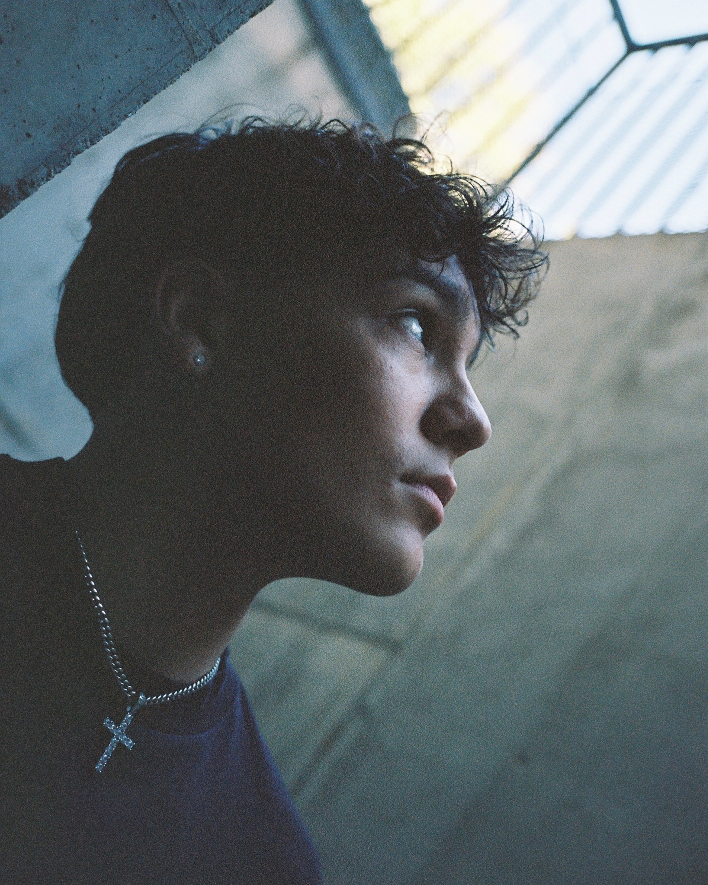 Trey Makai performing a contemporary dance move with focused expression and clean lines against an urban backdrop