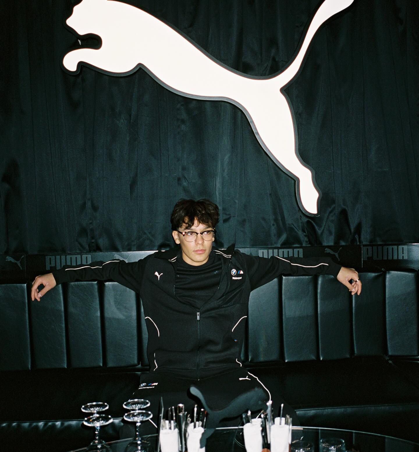 Trey Makai performing a contemporary dance move with focused expression and clean lines against an urban backdrop