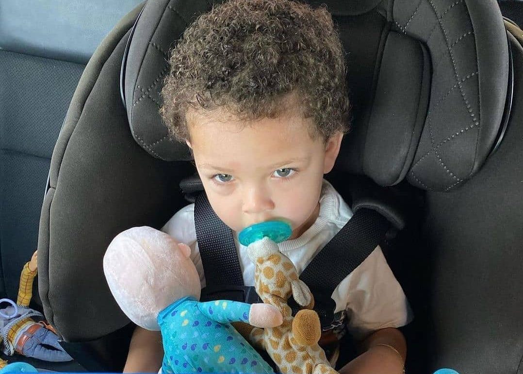 A softly lit silhouette of a young child at play, symbolizing early childhood and privacy.