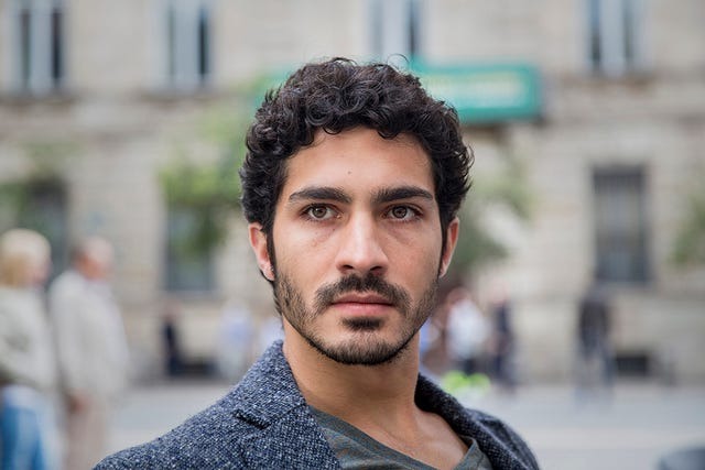 A composed portrait of Chino Darin with soft lighting and a calm expression, emphasizing mood and style.