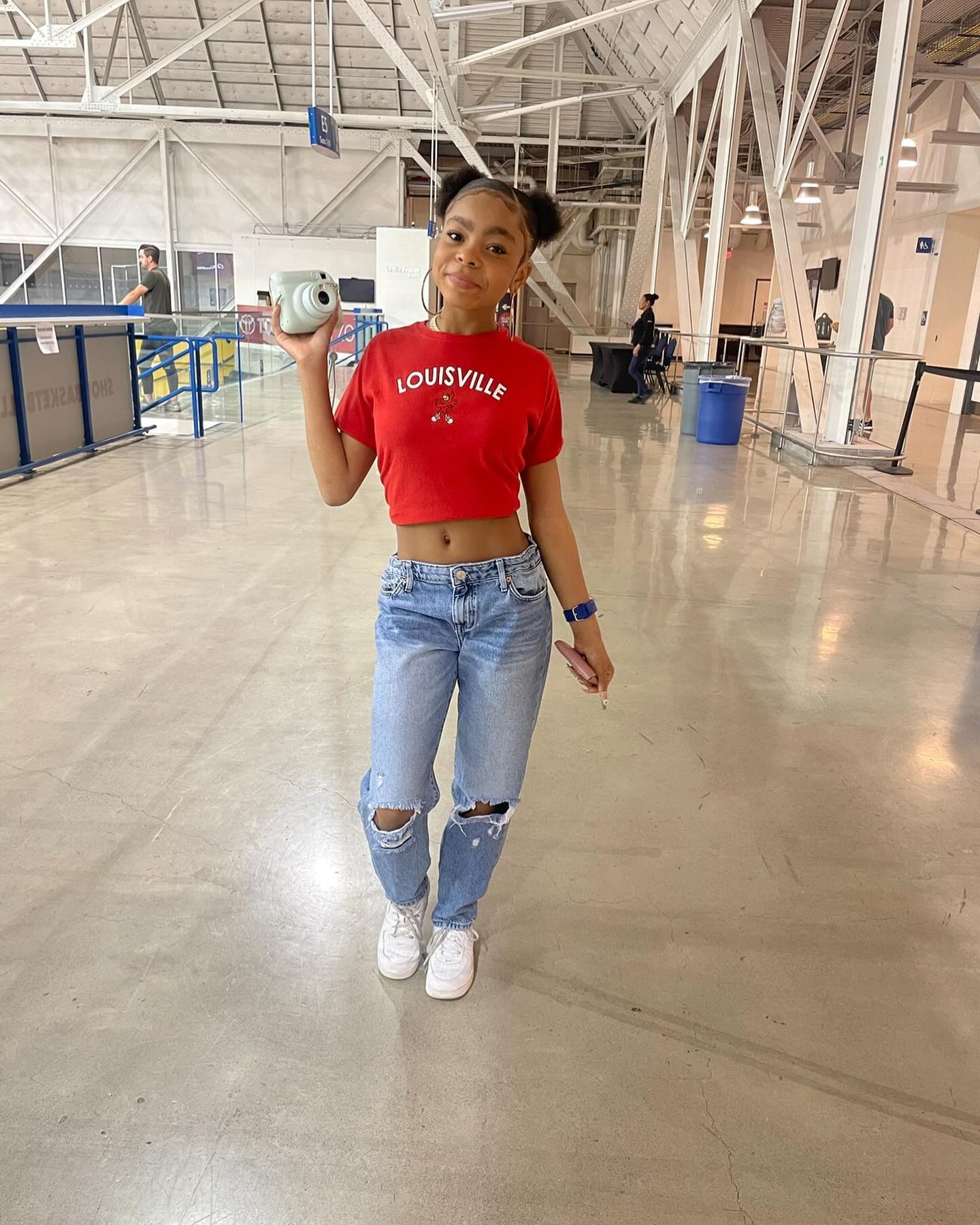 Young actress Amanda Christine smiling during a quiet moment on set