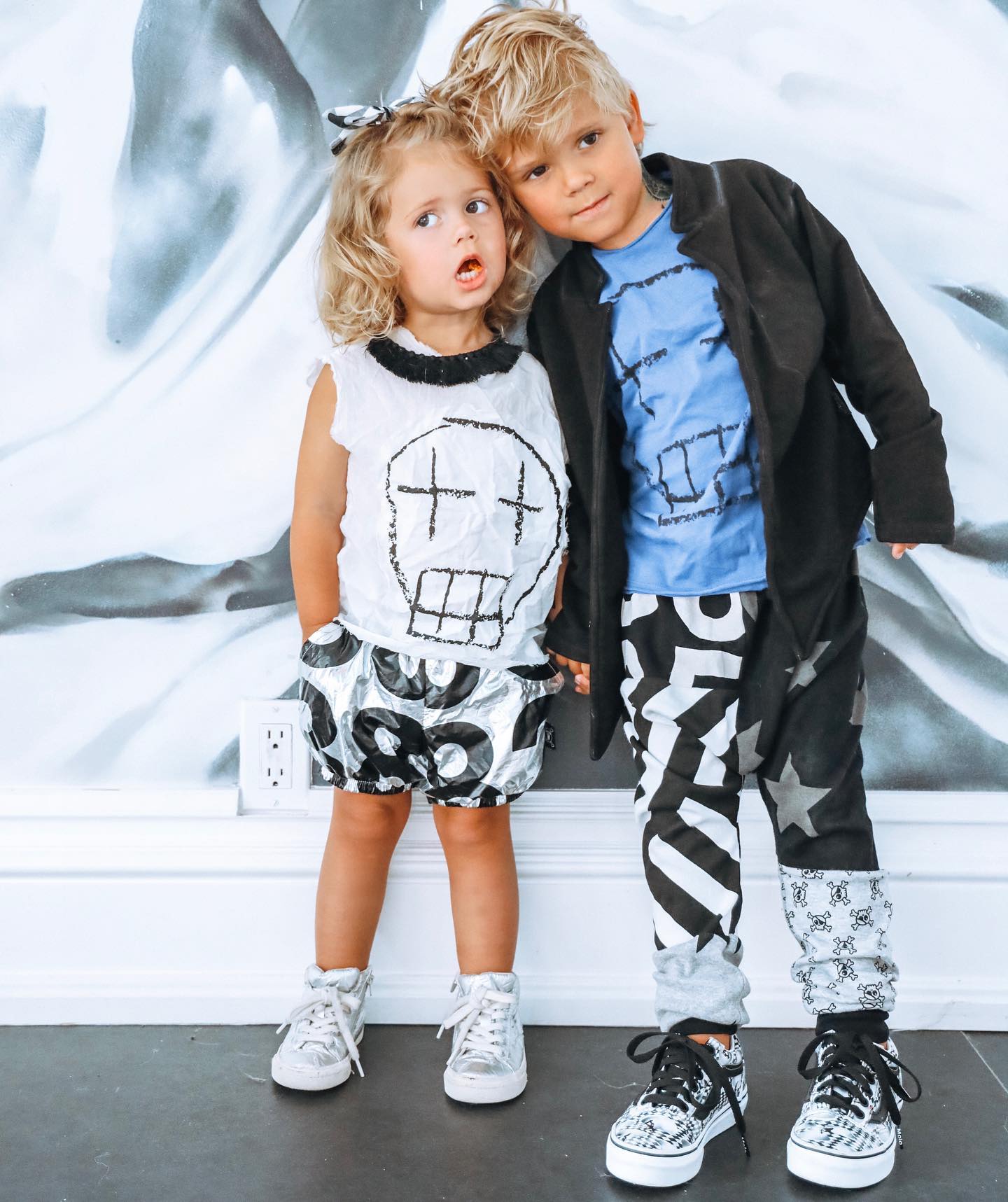 Young creator Tydus Talbott smiling with his family, representing a childhood spent in front of the camera and shaped by supportive parenting.